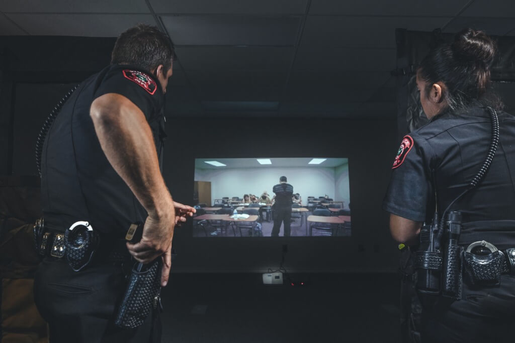 Two cops training on Laser shot simulator